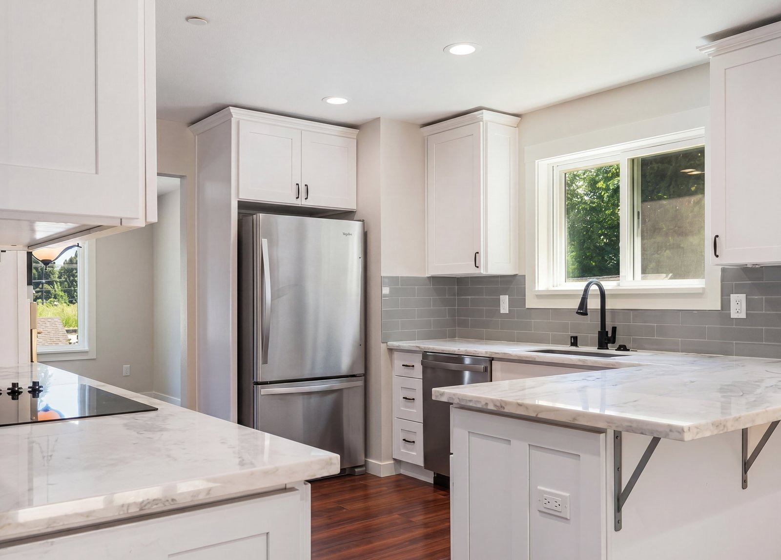 White kitchen with marble counters